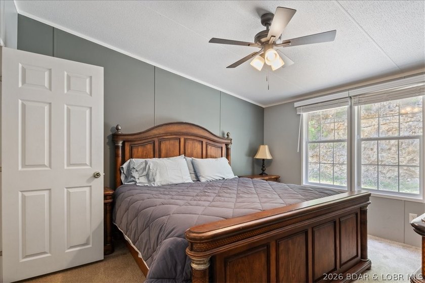 Discover this beautifully updated 4-bedroom, 3-bath lakefront - photo 4