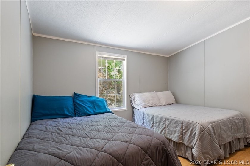 Discover this beautifully updated 4-bedroom, 3-bath lakefront - photo 8