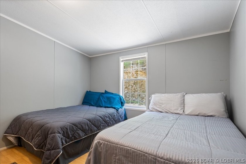 Discover this beautifully updated 4-bedroom, 3-bath lakefront - photo 9