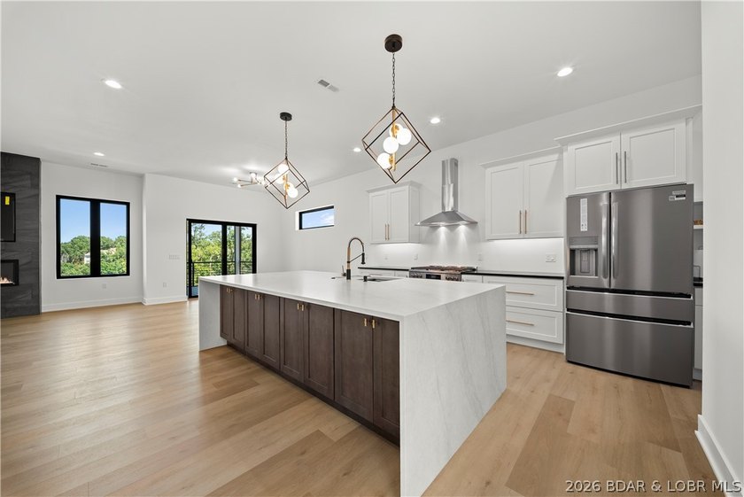 Introducing an exceptional new construction residence in the - photo 4