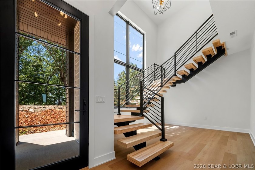 Introducing an exceptional new construction residence in the - photo 6