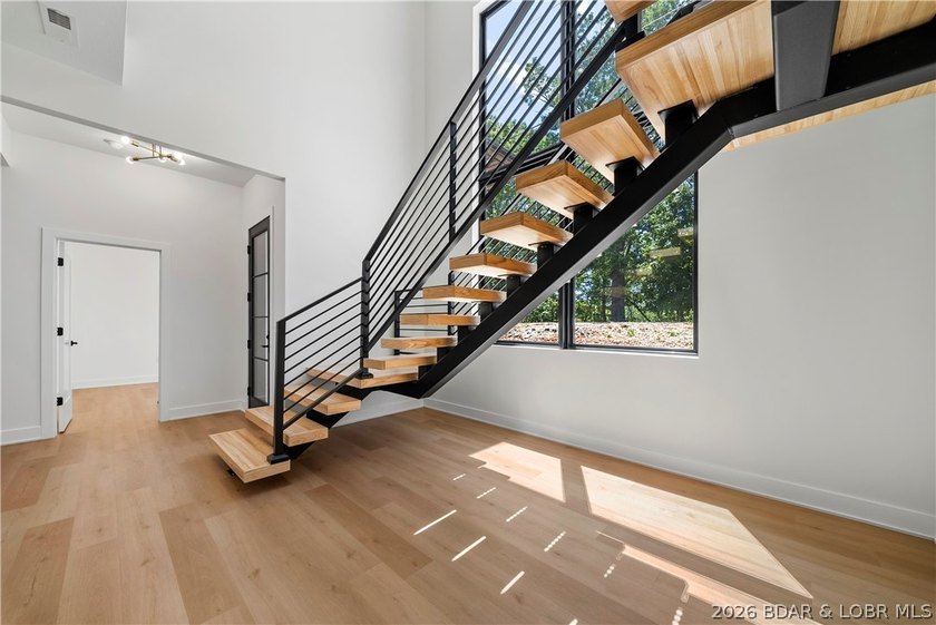 Introducing an exceptional new construction residence in the - photo 7