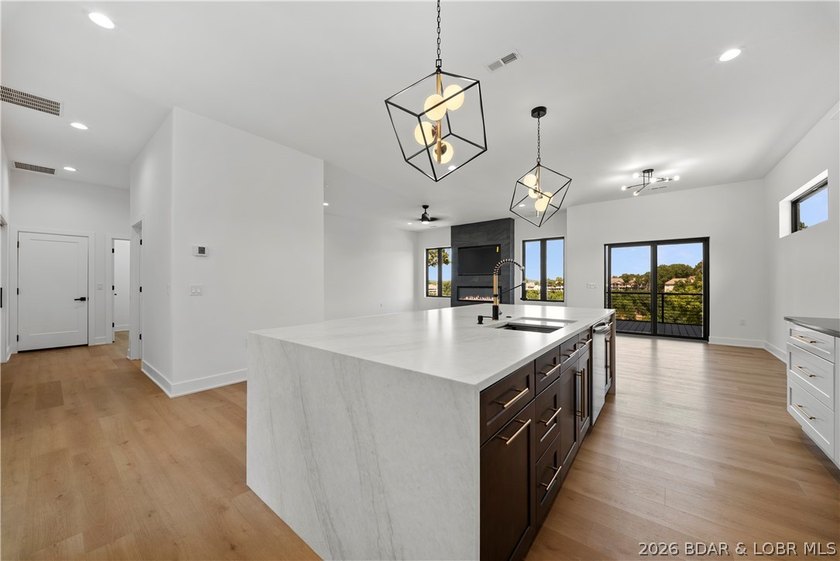 Introducing an exceptional new construction residence in the - photo 8