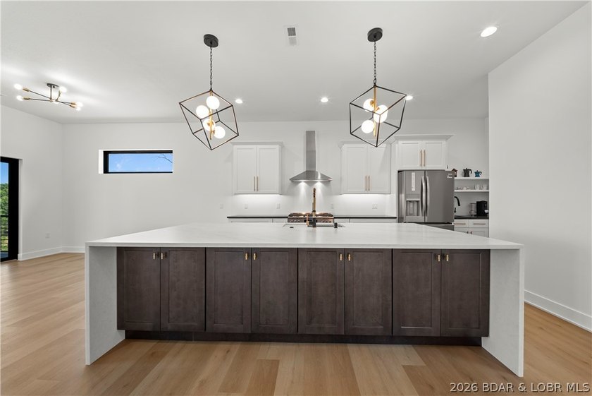 Introducing an exceptional new construction residence in the - photo 9
