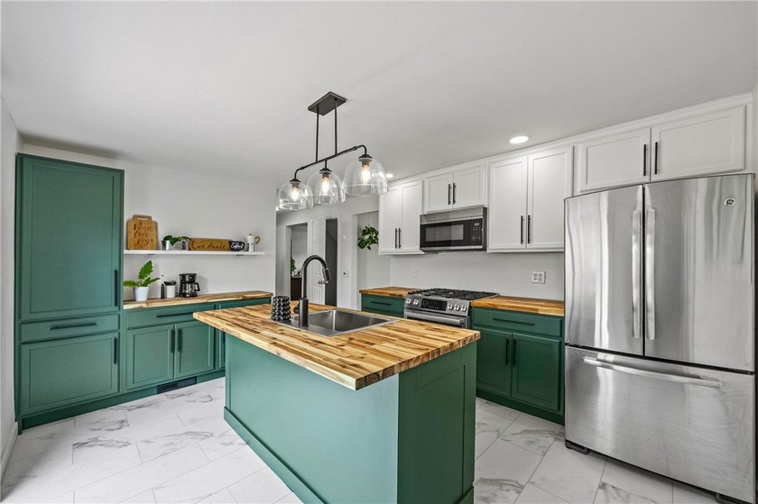 Welcome to 112 Sharon Drive, a beautifully updated 3-bedroom - photo 2