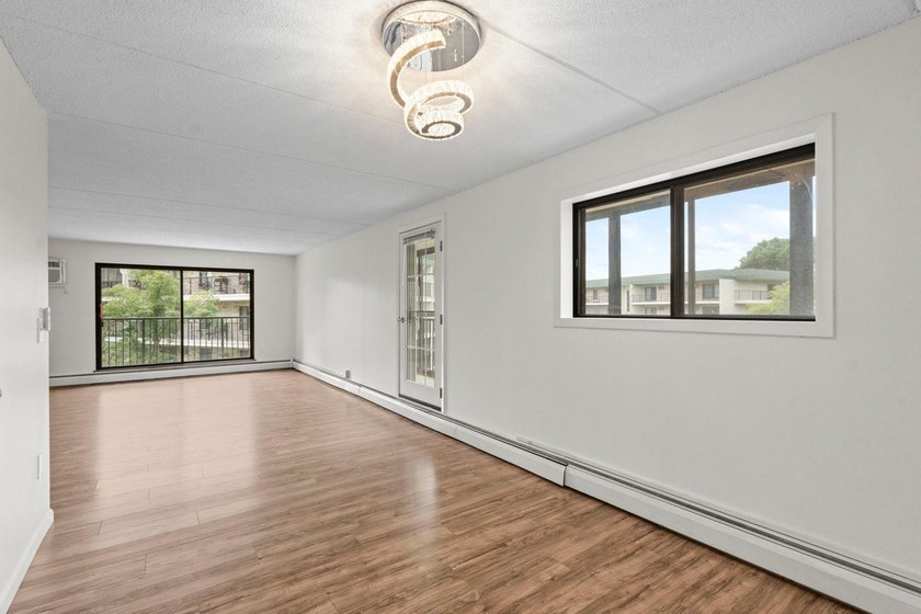 Rare opportunity to own a stunning 4th-floor corner unit in the - photo 50