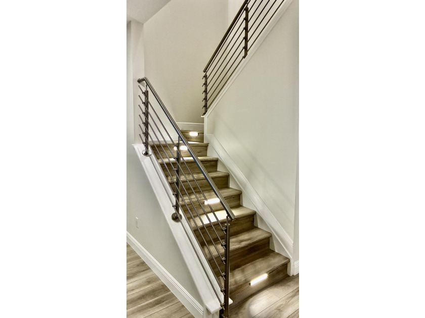 Welcome to this stunning tri-level Mediterranean-style townhome - photo 14