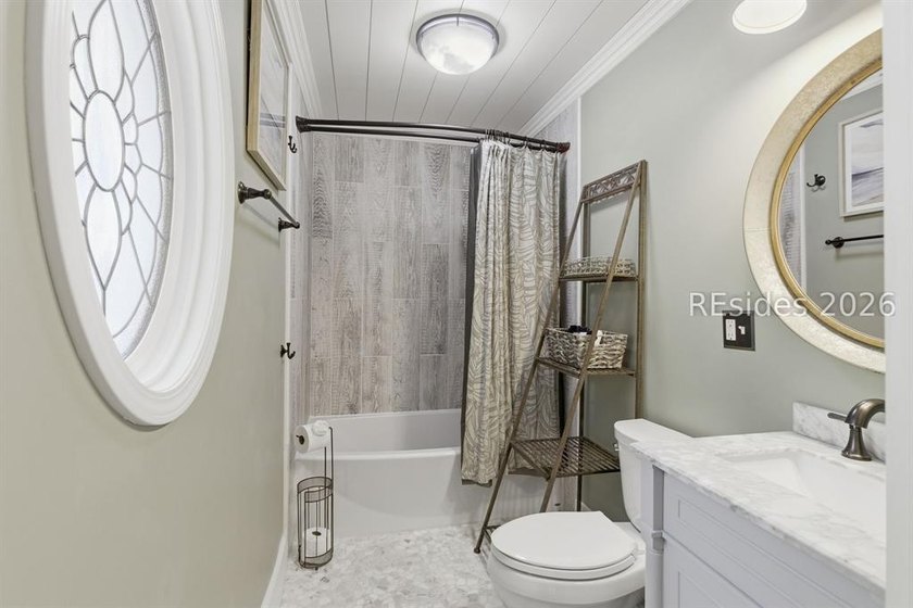 Nestled just steps from the ocean, this charming beach cottage - photo 21