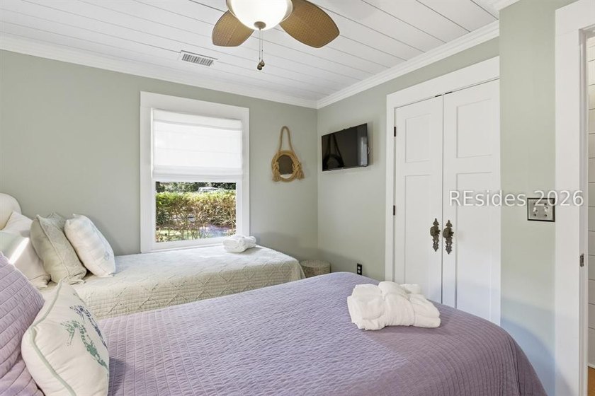 Nestled just steps from the ocean, this charming beach cottage - photo 24