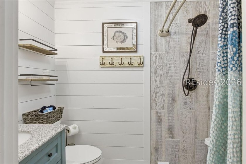 Nestled just steps from the ocean, this charming beach cottage - photo 25