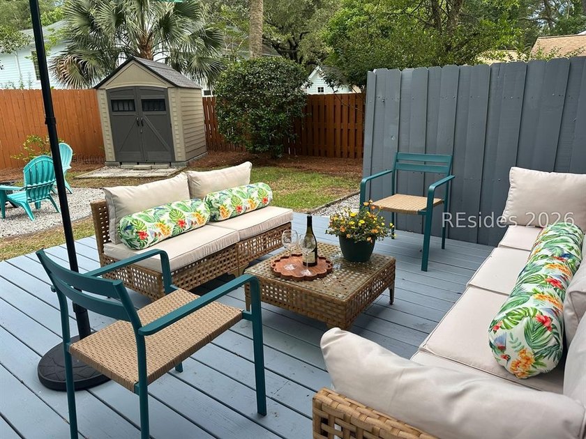 Nestled just steps from the ocean, this charming beach cottage - photo 32