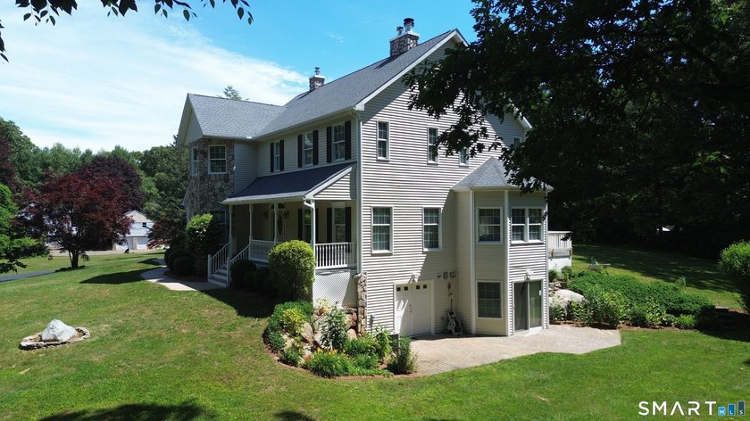 Situated on over an acre of manicured grounds, this custom-built - photo 2
