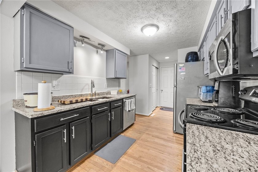 Welcome to this beautifully maintained townhome, which offers - photo 10