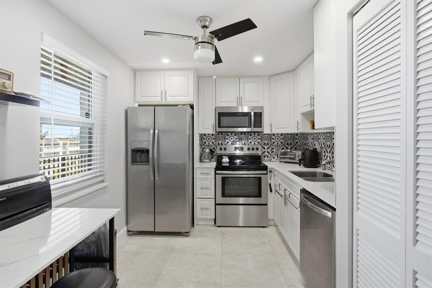 This spacious 3-bedroom, 2.5-bath corner unit in the gated *18th - photo 14
