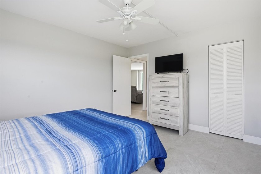 This spacious 3-bedroom, 2.5-bath corner unit in the gated *18th - photo 25