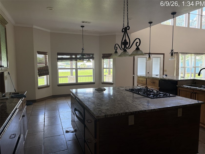 Set on 1.48 wooded acres along Lake Limestone, this custom stone - photo 11