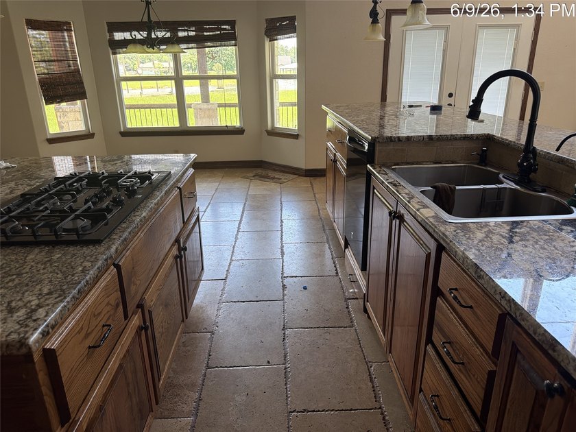 Set on 1.48 wooded acres along Lake Limestone, this custom stone - photo 12