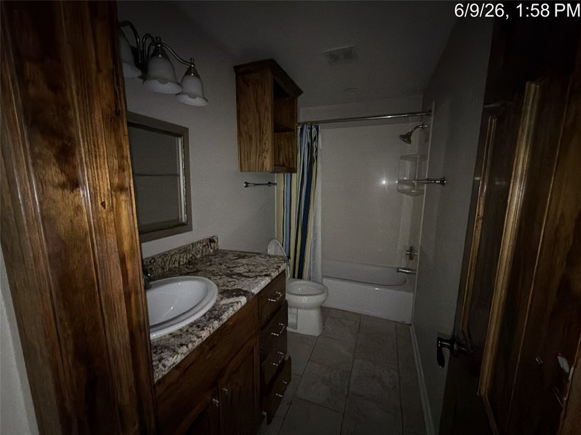 Set on 1.48 wooded acres along Lake Limestone, this custom stone - photo 28