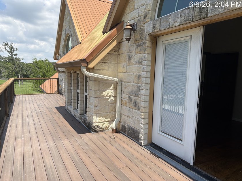 Set on 1.48 wooded acres along Lake Limestone, this custom stone - photo 32