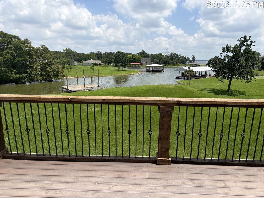 Set on 1.48 wooded acres along Lake Limestone, this custom stone - photo 34