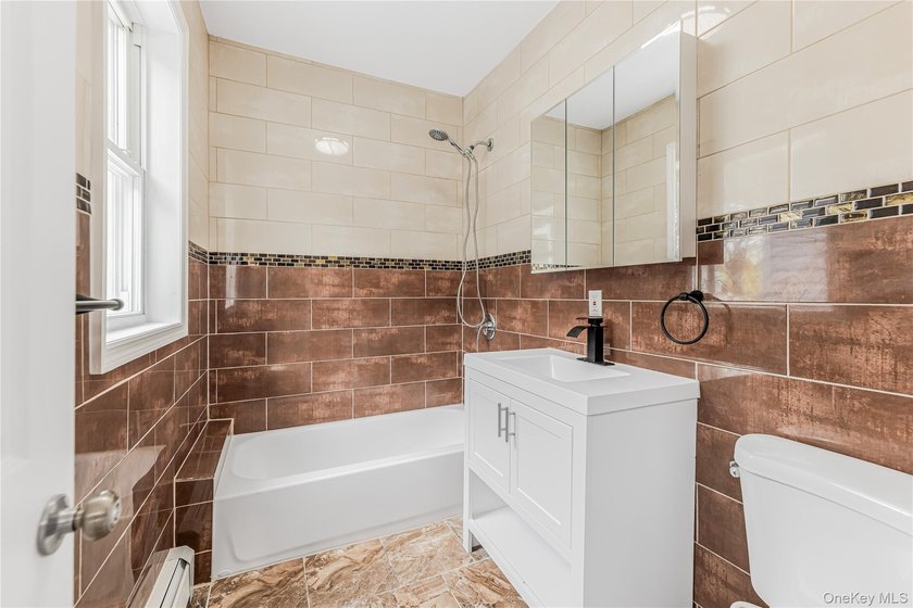 Beautifully renovated 3 bed, 2/1 bath home offering bright and - photo 11