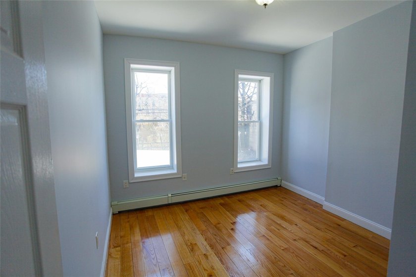 This well-maintained legal two-family, 6 bedroom, 3 bath brick - photo 11