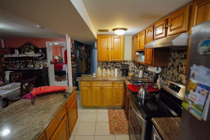 This well-maintained legal two-family, 6 bedroom, 3 bath brick - photo 25