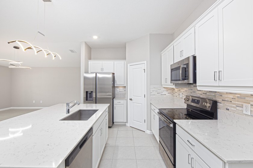 Welcome home to this beautifully constructed home located in the - photo 12