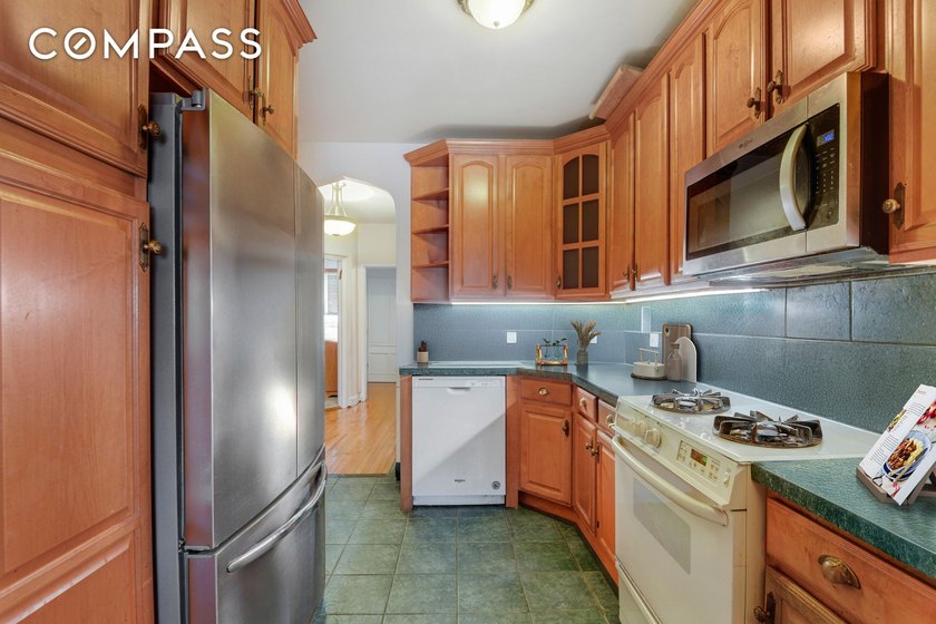 Discover the timeless appeal of this elegant, fully-brick - photo 3