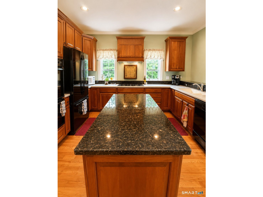 Situated on over an acre of manicured grounds, this custom-built - photo 12