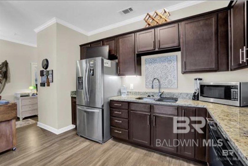 Enjoy a LOW-MAINTENANCE coastal lifestyle in a CHARMING - photo 22