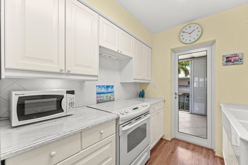 Location truly is everything. Just steps from the beach, this - photo 12