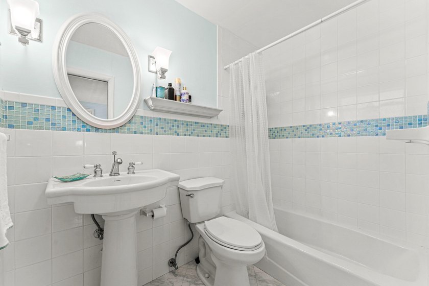 Location truly is everything. Just steps from the beach, this - photo 18