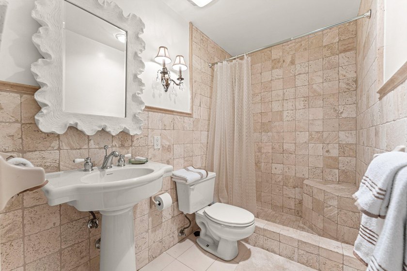 Location truly is everything. Just steps from the beach, this - photo 23