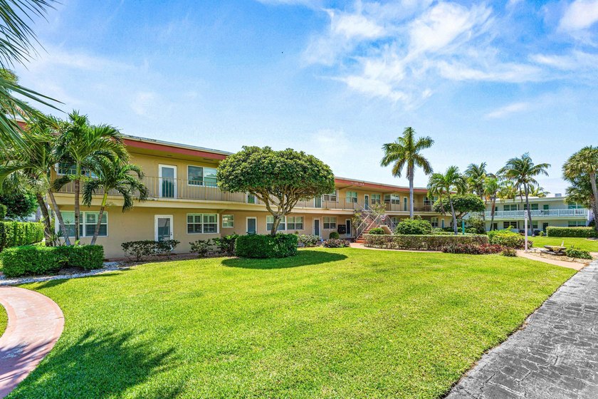 Location truly is everything. Just steps from the beach, this - photo 34