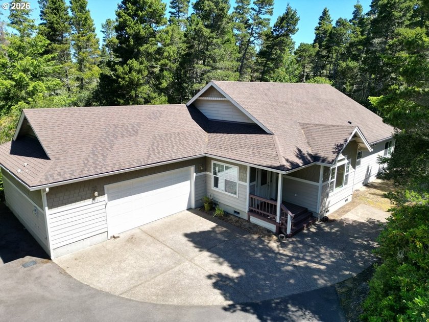 Nestled in a peaceful wooded setting within the desirable Heceta - photo 2