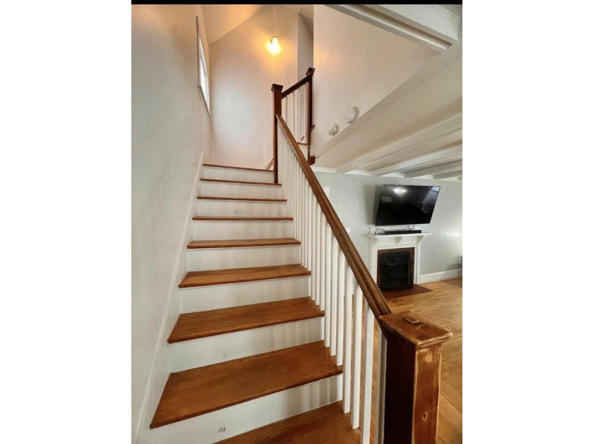 Step into this cozy 2-bedroom, 1.5-bath New Englander, where - photo 6
