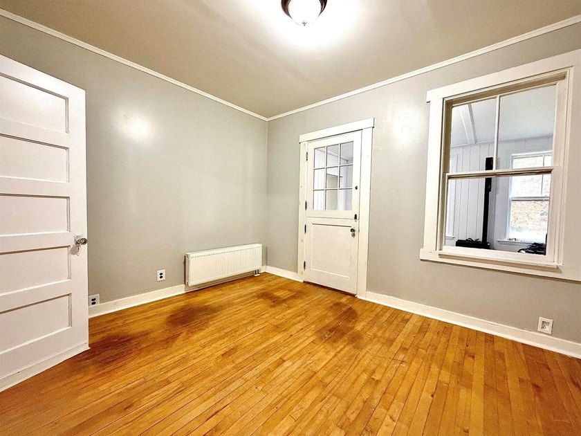 Step into this cozy 2-bedroom, 1.5-bath New Englander, where - photo 7
