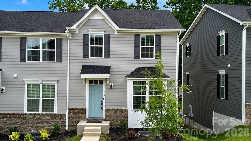 Welcome to this beautifully appointed corner unit townhome in - photo 2