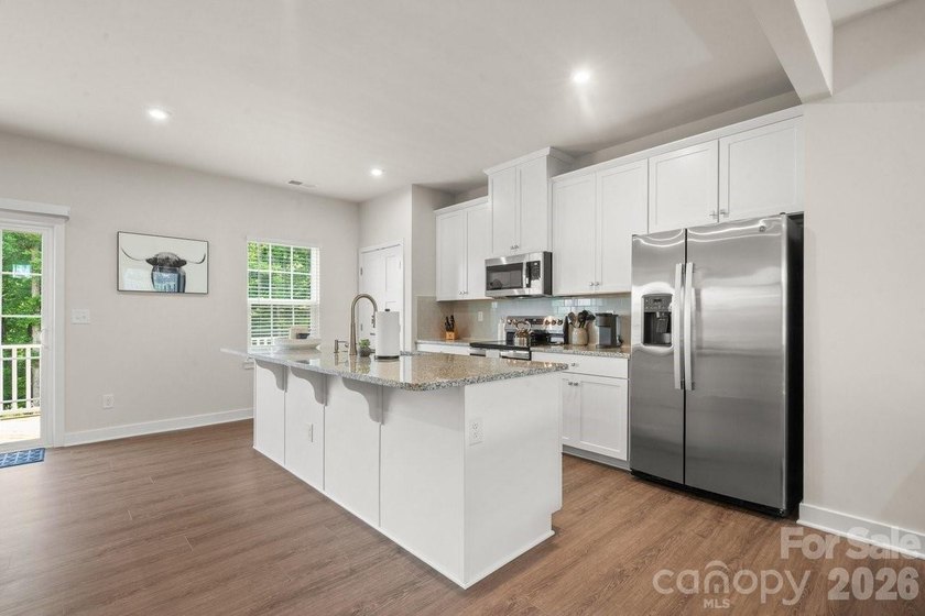 Welcome to this beautifully appointed corner unit townhome in - photo 9