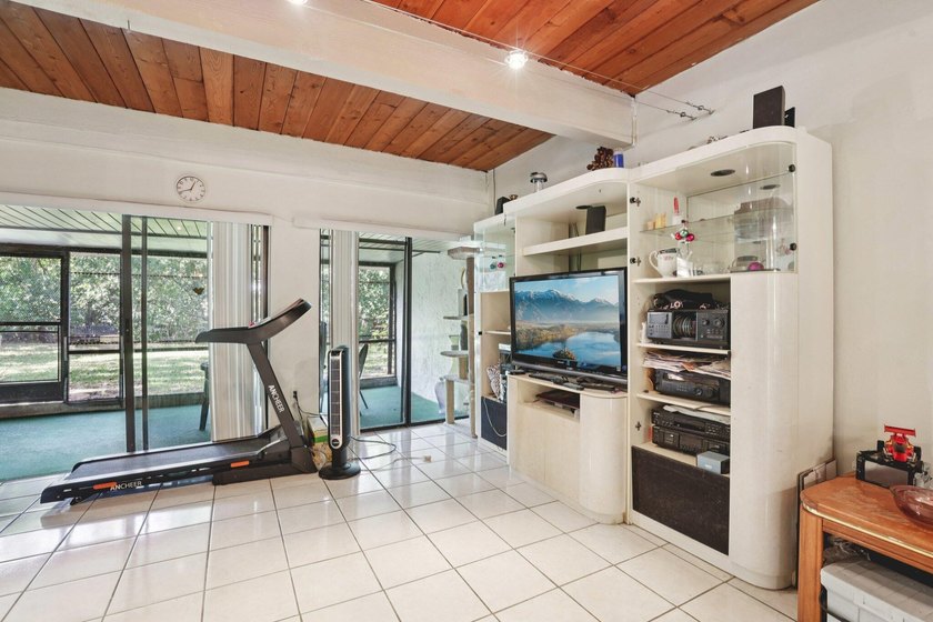 Discover a rare corner-unit retreat in a secure, gated community - photo 11