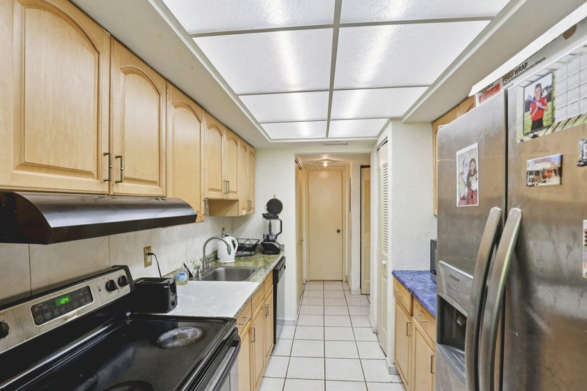 Discover a rare corner-unit retreat in a secure, gated community - photo 16