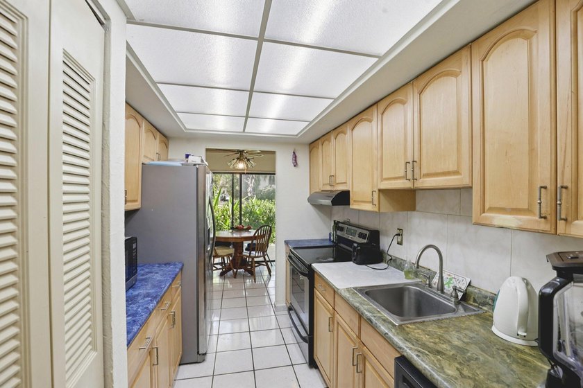 Discover a rare corner-unit retreat in a secure, gated community - photo 17