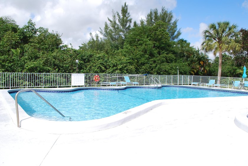 Discover a rare corner-unit retreat in a secure, gated community - photo 42