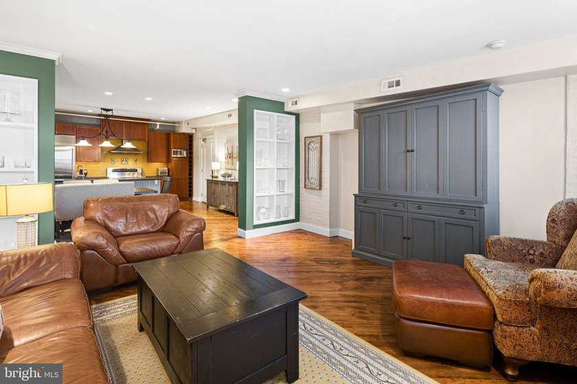 This beautifully updated penthouse offers a unique blend of - photo 11