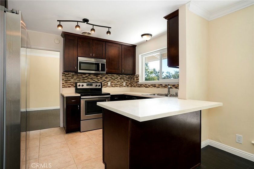 Tucked away in a quiet rear location within the community, this - photo 13