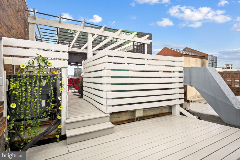 This beautifully updated penthouse offers a unique blend of - photo 14