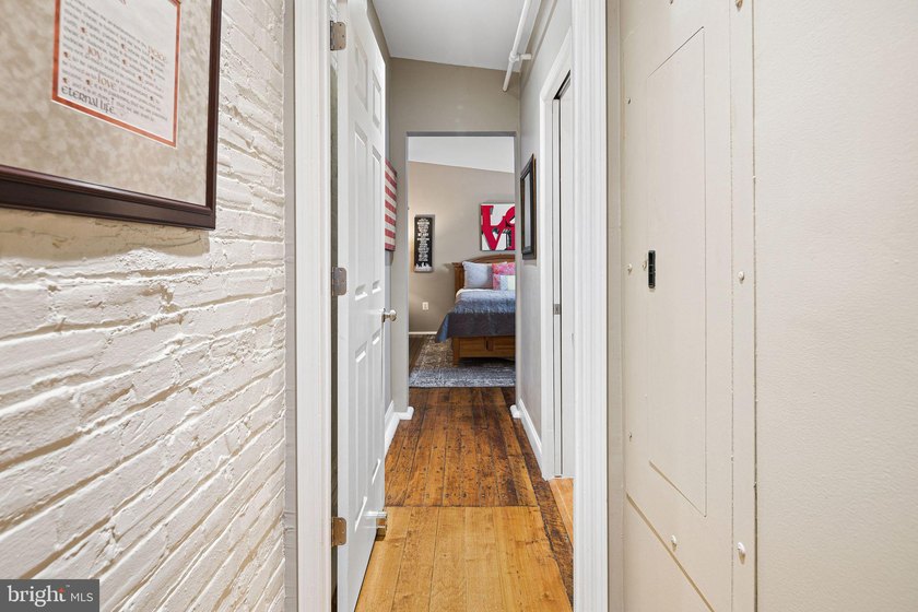 This beautifully updated penthouse offers a unique blend of - photo 16