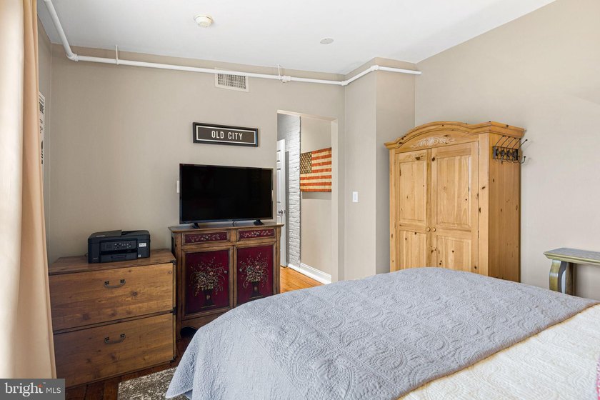This beautifully updated penthouse offers a unique blend of - photo 23