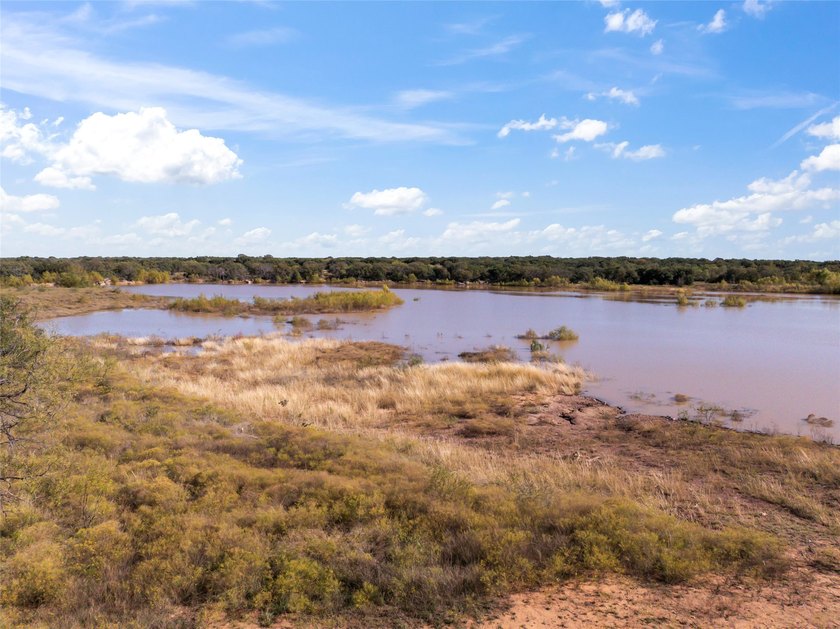 187.79 acres with 20+ acre lake and dam. Paved county road - photo 3